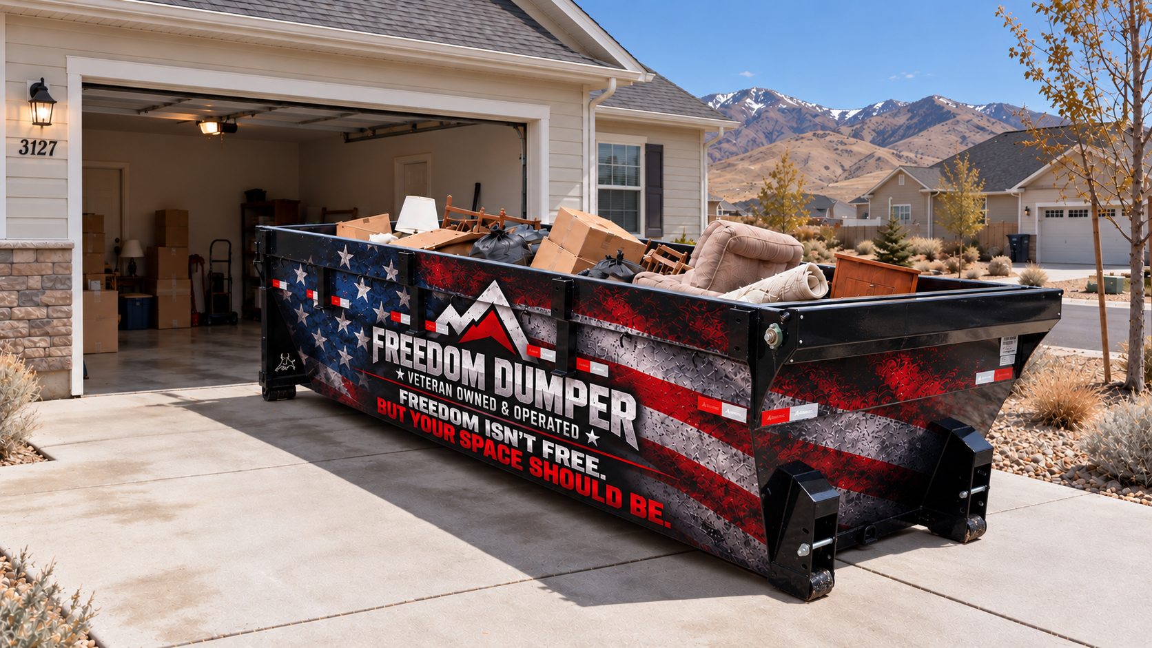 Long, low-profile Freedom Dumper roll-off bin in a Utah neighborhood driveway during a household cleanout